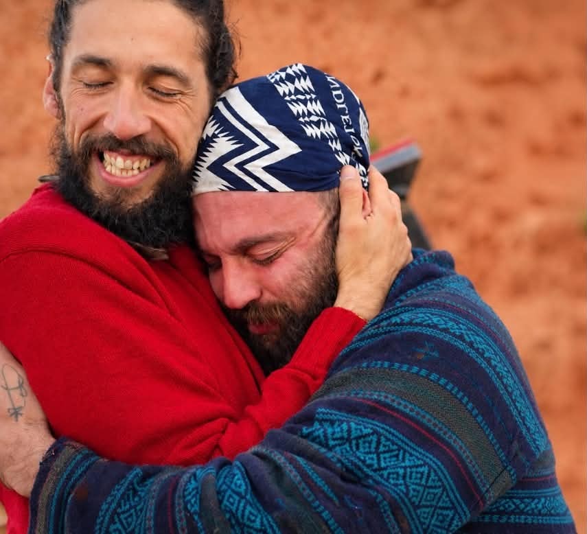 Two men embracing in healing moment